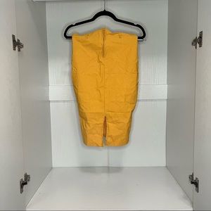 Two skirts one yellow one blood orange . Pencil skirt. Good stretch.